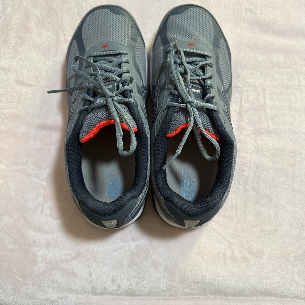 New Balance Gray and Black Athletic Shoes with Red Accents